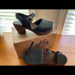 Lotta’s black leather covered toe wooden clog